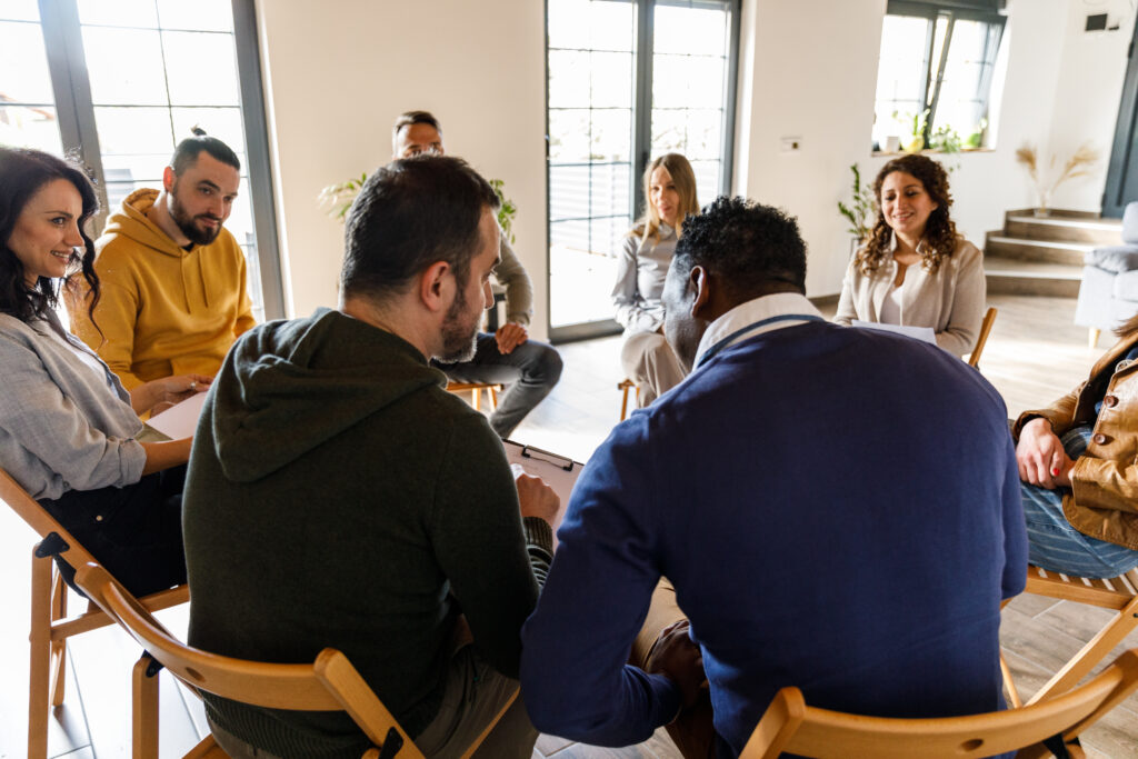 A group of adults sitting in a circle